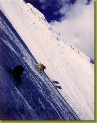 Cutting steps in an ice wall at 19,000 feet leading to the<br />Himalayan pass of Ambu Lapcha