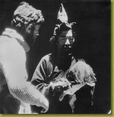 Peter with the famous Yeti scalp, at Pangboche Temple in the<br />Sola Khumbu district of the Himalaya in 1958